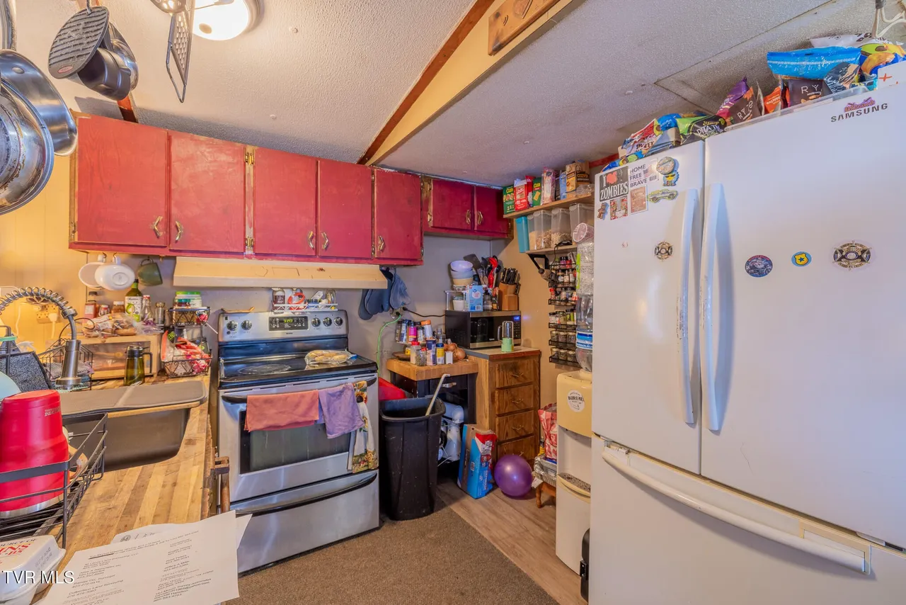 Kitchen with updated countertops and stainless range