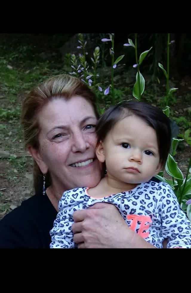 Lori Osmun holding Willow as a baby