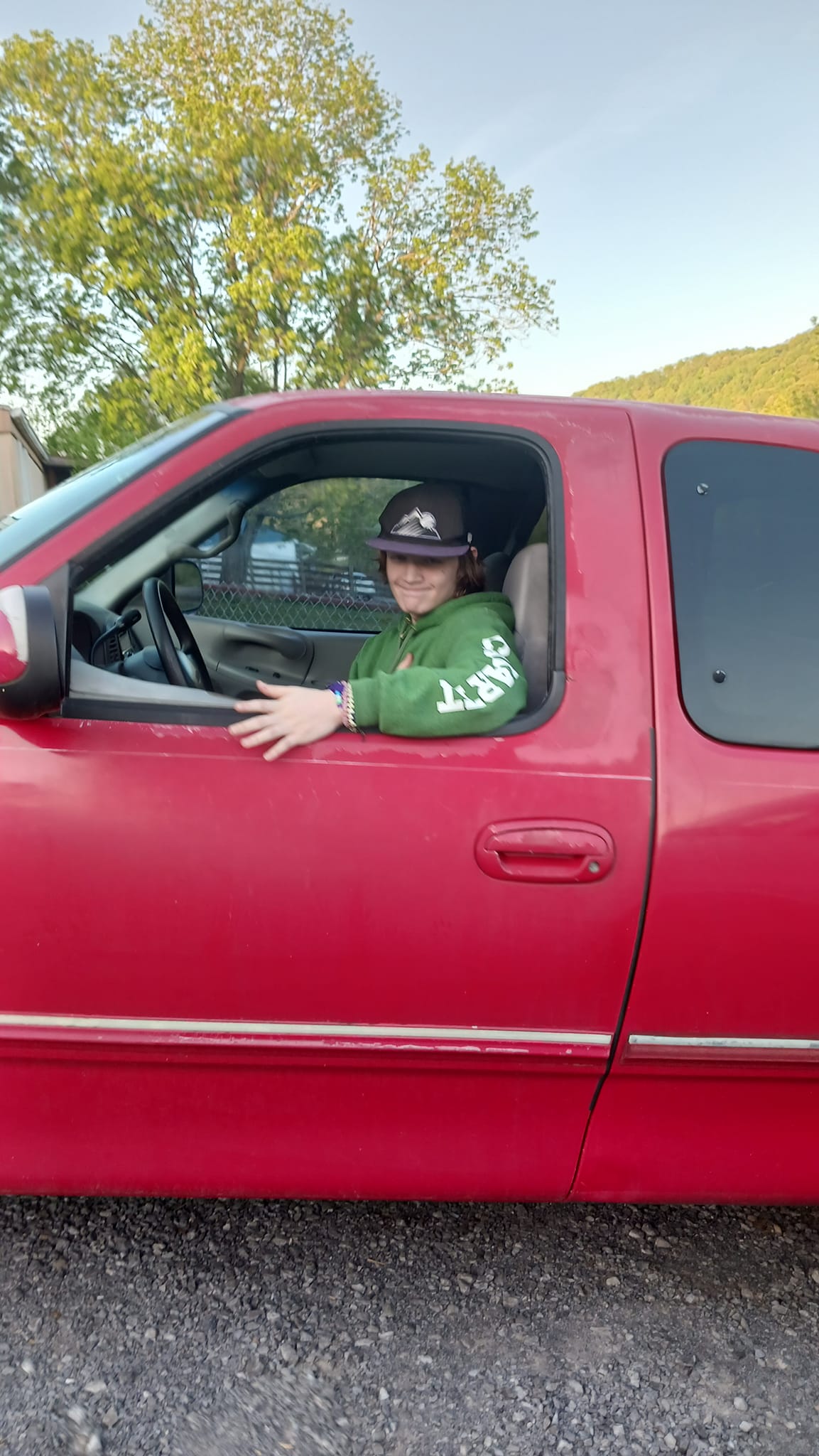 Riley in the first pickup truck he bought from working part time with his dad