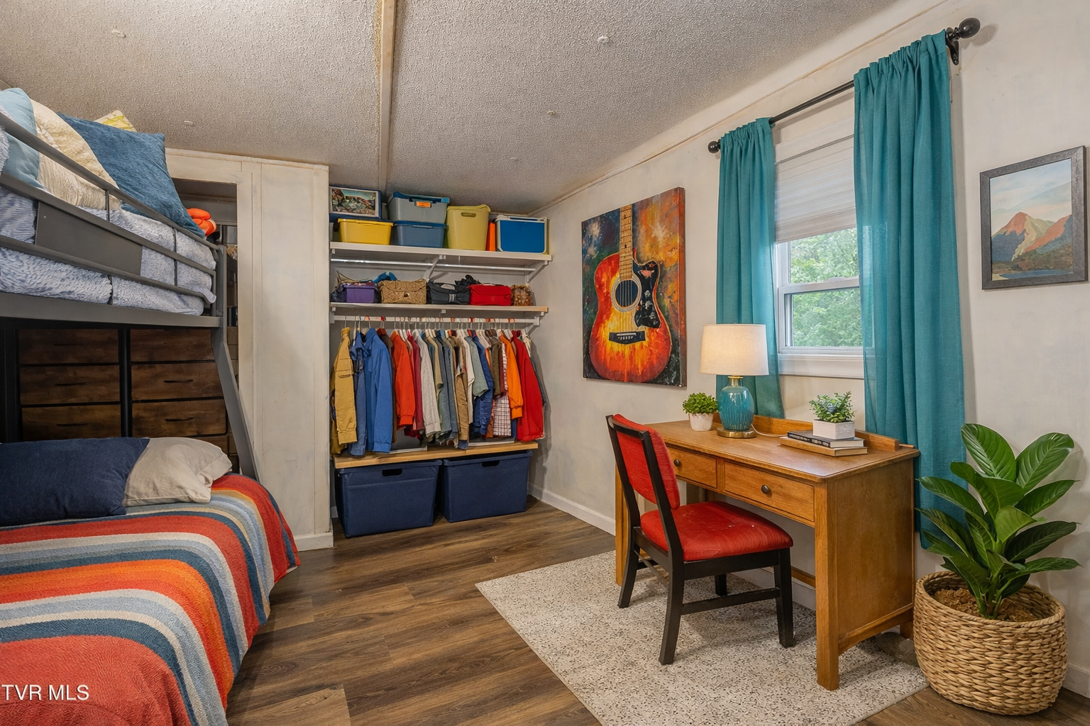 Second bedroom set up as a flexible office and sleeping space
